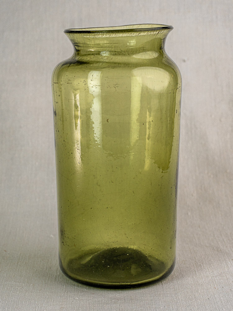 Antique French olive green glass preserve jar, hand blown with tall cylindrical form and flared rim. Late 18th century.