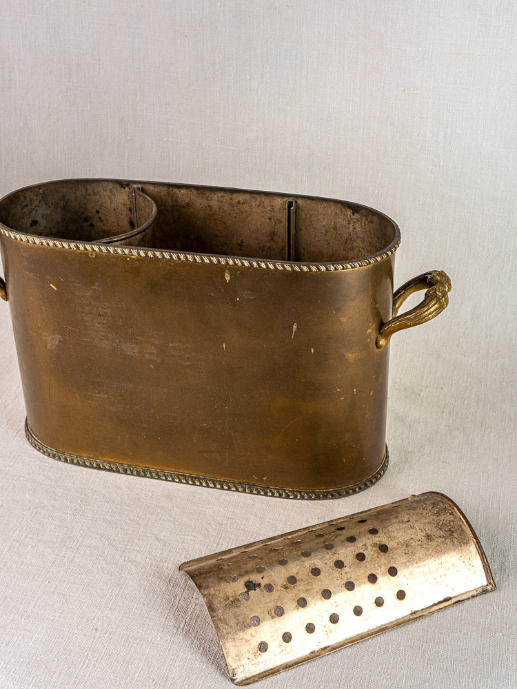 Antique French brass double champagne cooler with decorative handles, rope trim, and removable perforated cover.