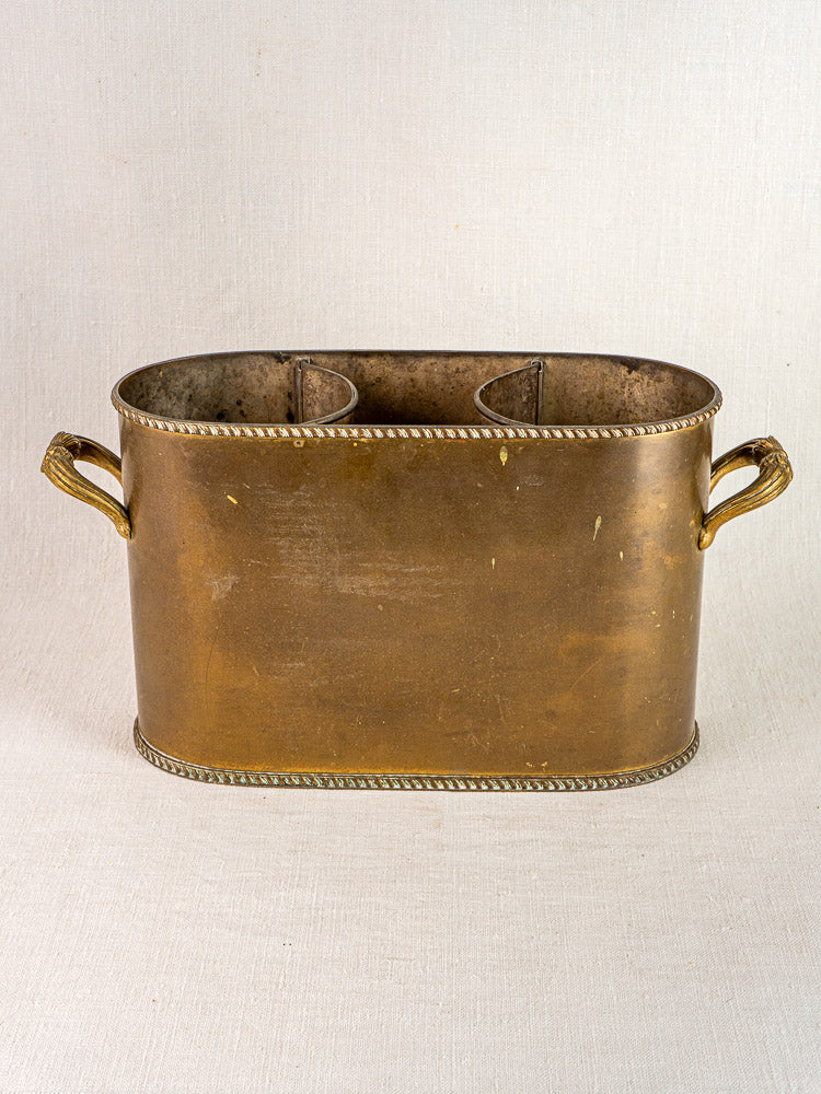 Antique French brass double champagne cooler with oval shape, rope trim, and two side handles.