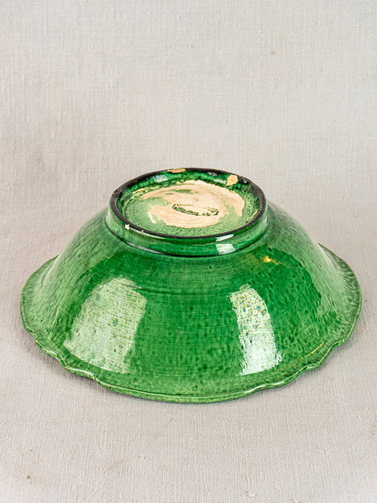 French Vallauris bowl by Foucard-Jourdan, early 20th century, green glaze, upside down on textured surface.