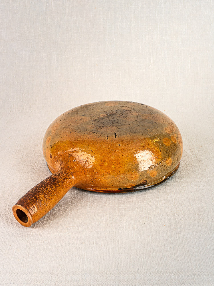 Antique French Vallauris glazed poêlon, brown terracotta ceramic with short spout, circa 1900–1930s.