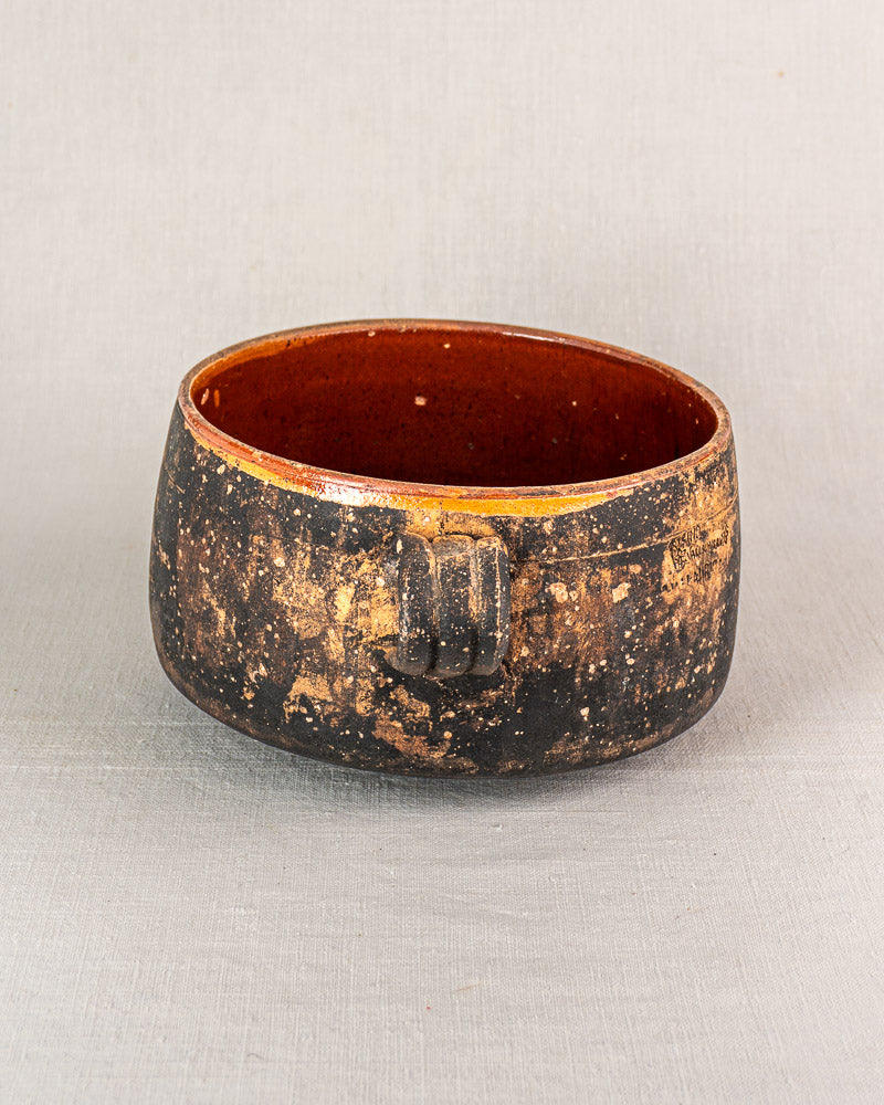 Early 20th century Vallauris glazed terracotta cooking pot, rustic round form, brown mottled glaze, square handle.