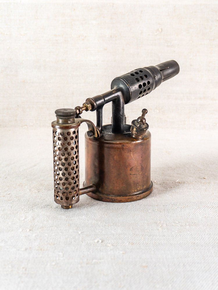 Antique French Vesta F.J. Paris blowtorch, circa 1920, with cylindrical tank and perforated shield.