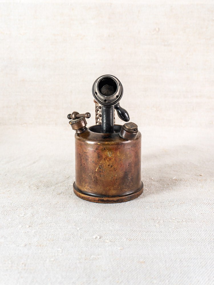 Antique French blowtorch by Vesta F.J. Paris, circa 1920, with handle and nozzle, aged patina.