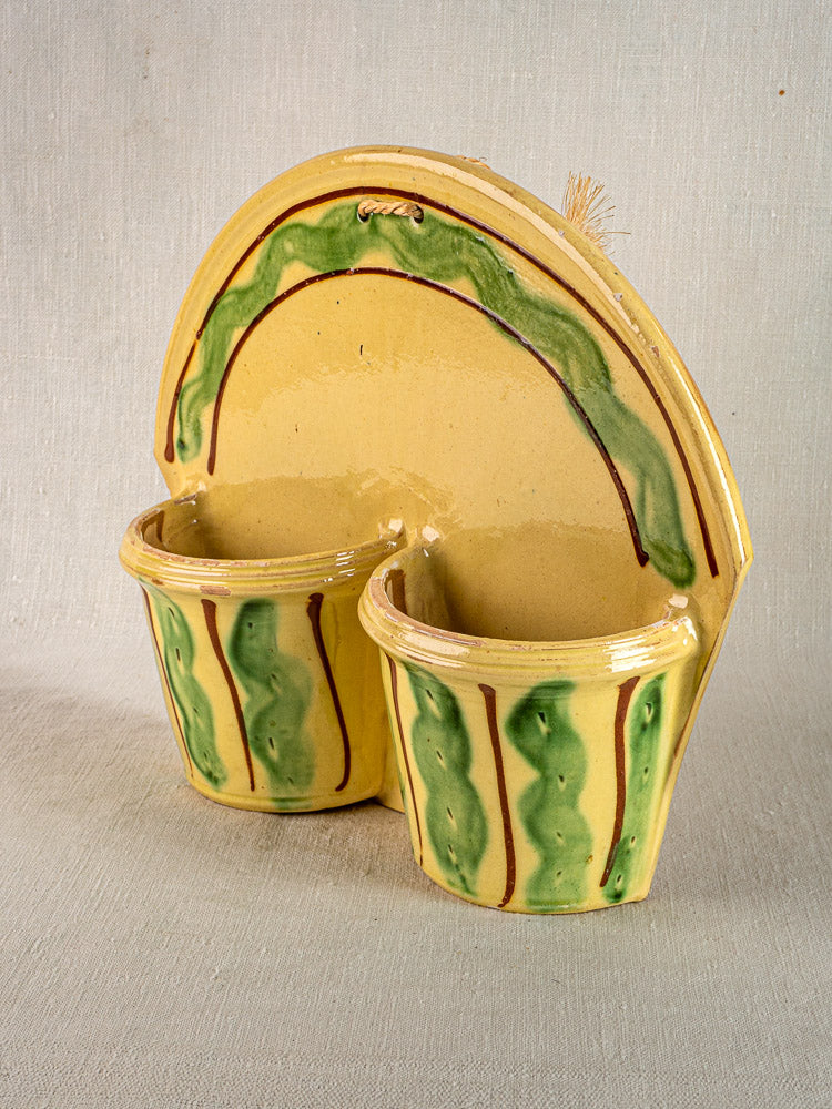 Vintage French Cliousclat terre vernissée cutlery holder with yellow ceramic glaze, Provençal accents, on textured fabric.