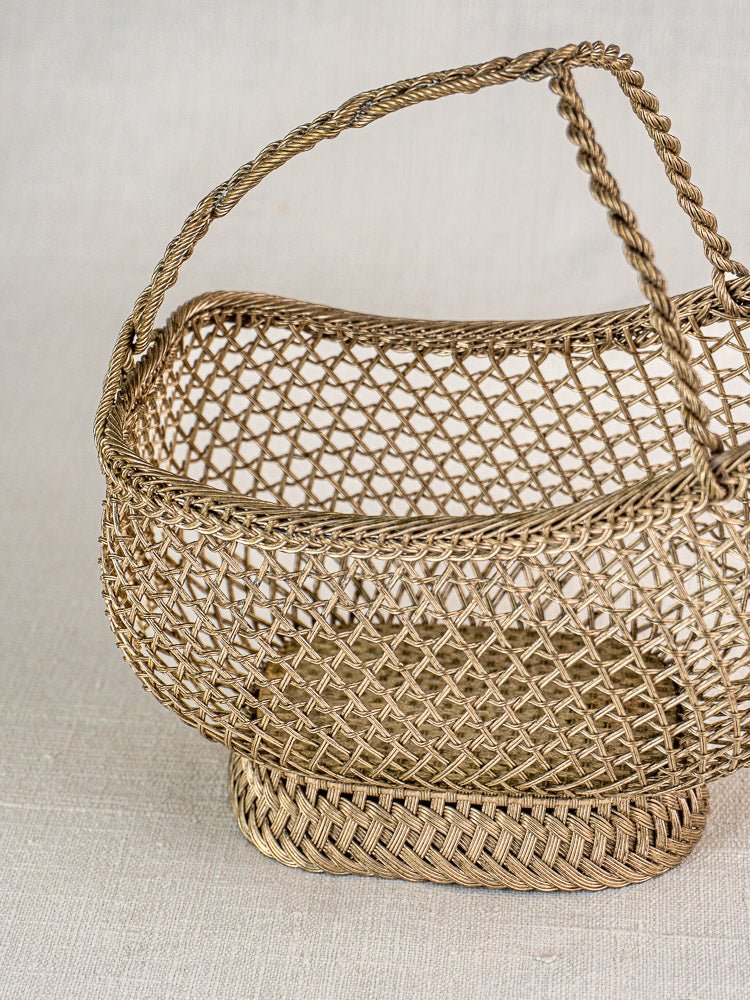 Antique French silver plate wirework wine bottle holder with open-weave design and decorative handle.