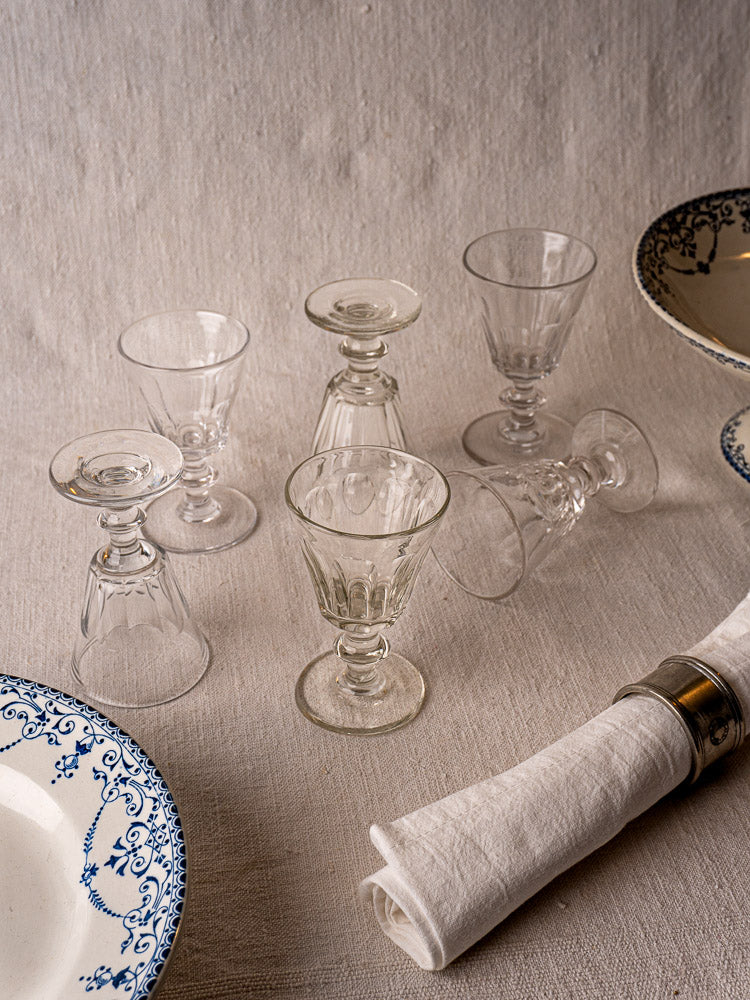 Six French hand-cut uranium Ouraline crystal wine glasses displayed in two rows.