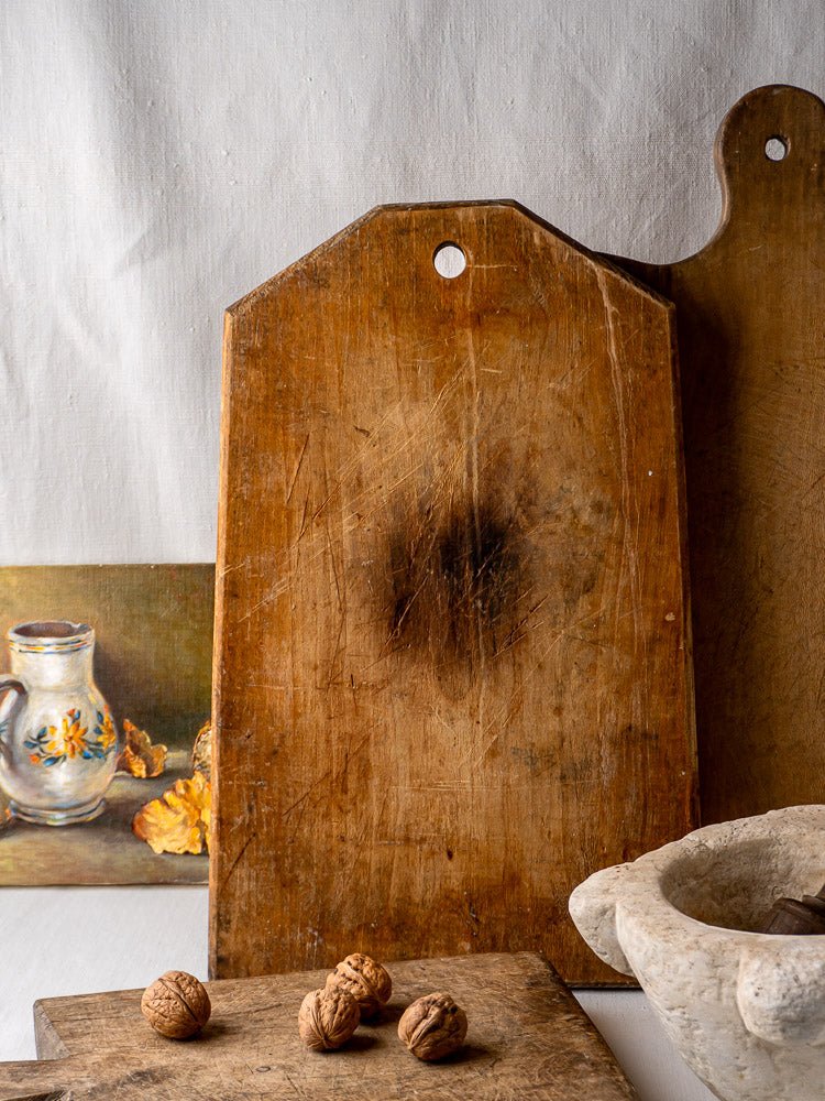 Antique 19th-century French Tombstone Cutting Board with angled corners, aged patina, and visible use marks.