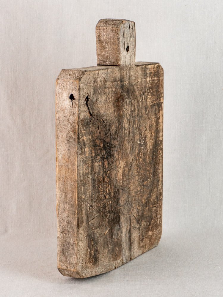 Antique French solid wood bread board with handle, late 19th century, rustic patina.