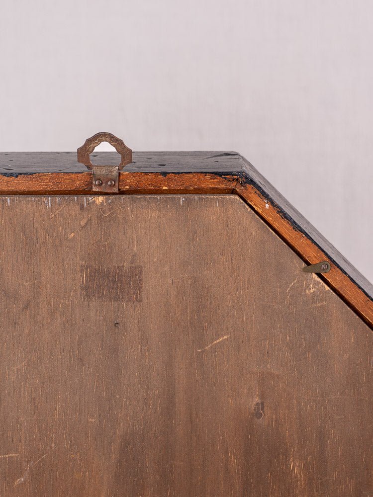 Antique French wall clock in black painted wood with metal handle, gently worn vintage finish.