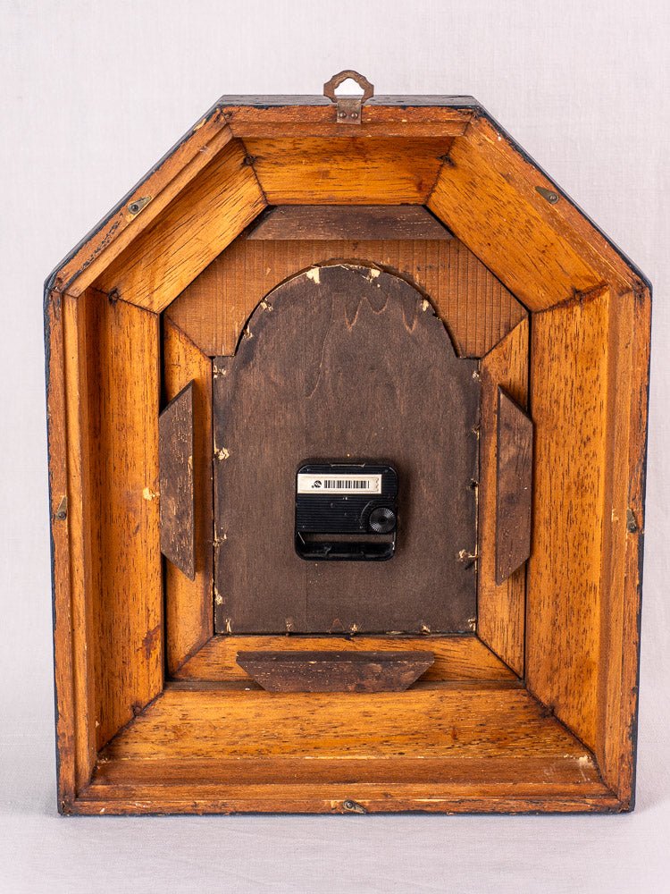 Black-painted wooden octagonal frame, back view, unfinished edges, hanging hook, and barcode; no clock face.