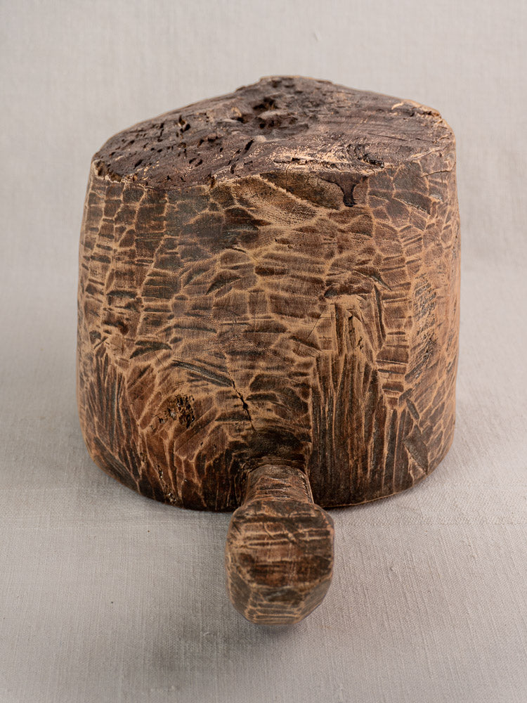 Antique French wooden mortar and pestle, hand-carved with rich brown weathered grain.