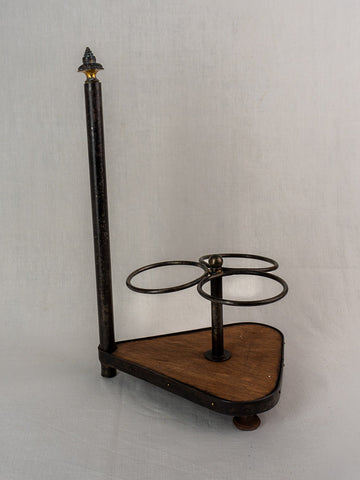 Antique French wrought iron and wood bottle carrier with three holders and decorative finial.