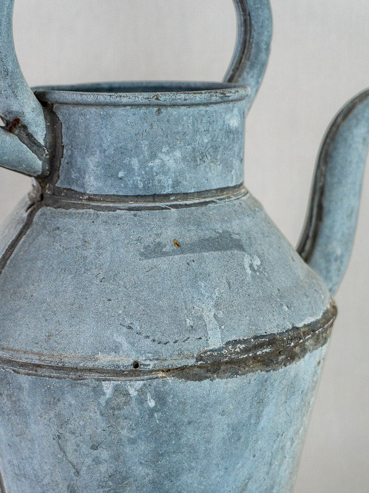 French antique zinc broc à eau with handle, spout, blue-gray patina, and rustic texture.