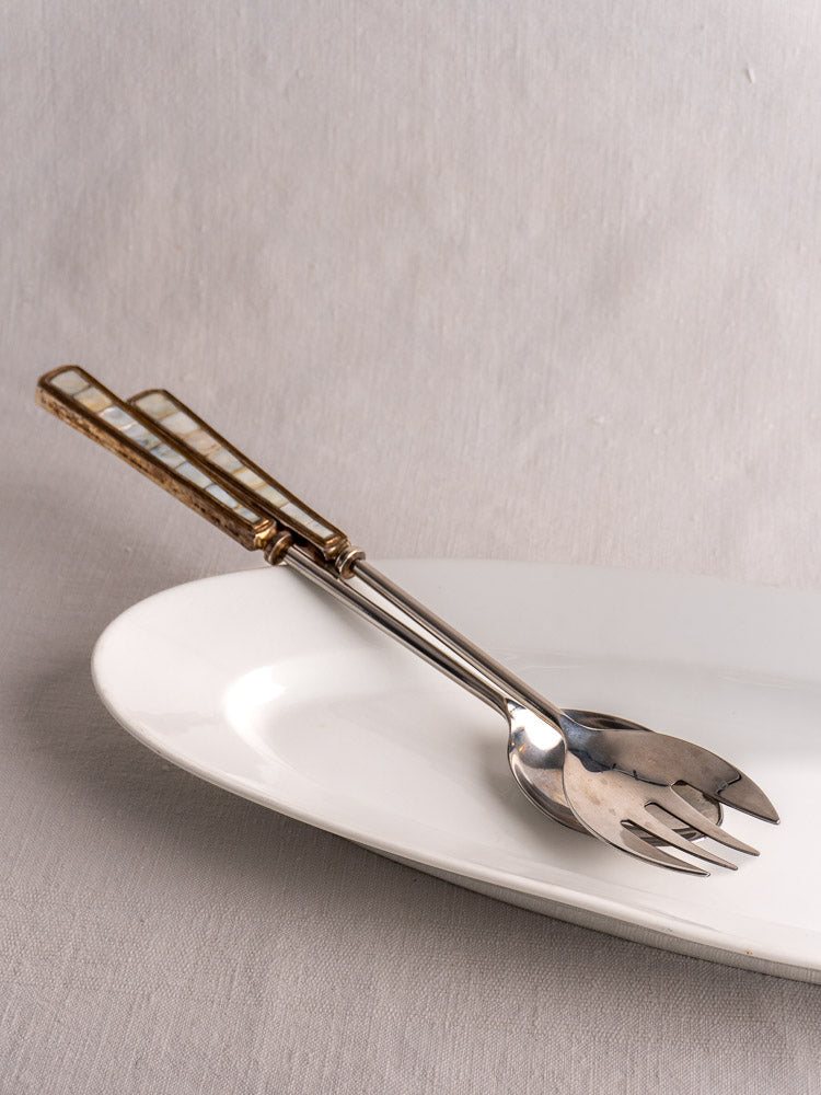 19th-century antique French white ironstone turbot platter displayed on a black stand, gray background.