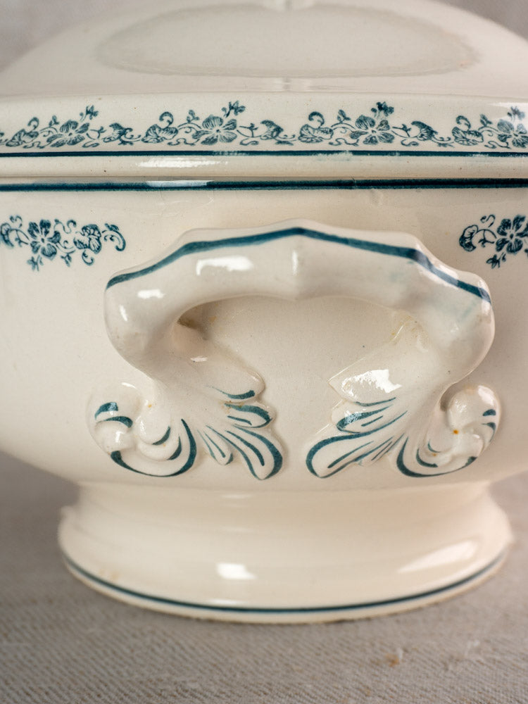 Antique French Longwy ironstone soup tureen with blue Capucine floral transferware and ornate handle.