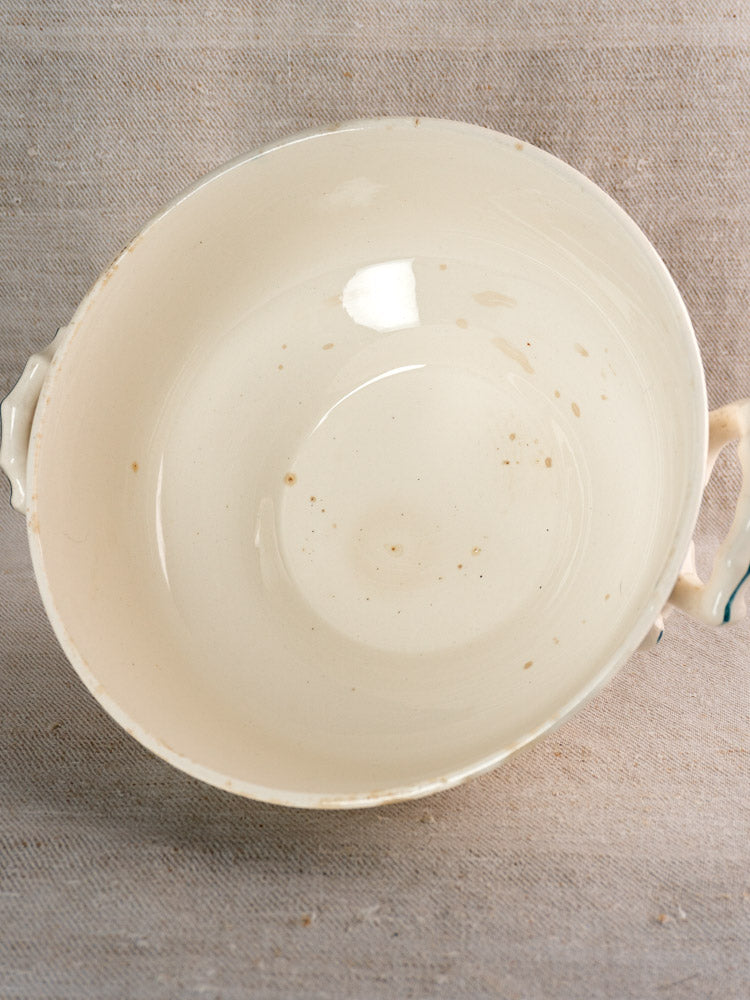 Antique French Longwy ironstone soup tureen in Capucine blue, two handles, visible interior patina.
