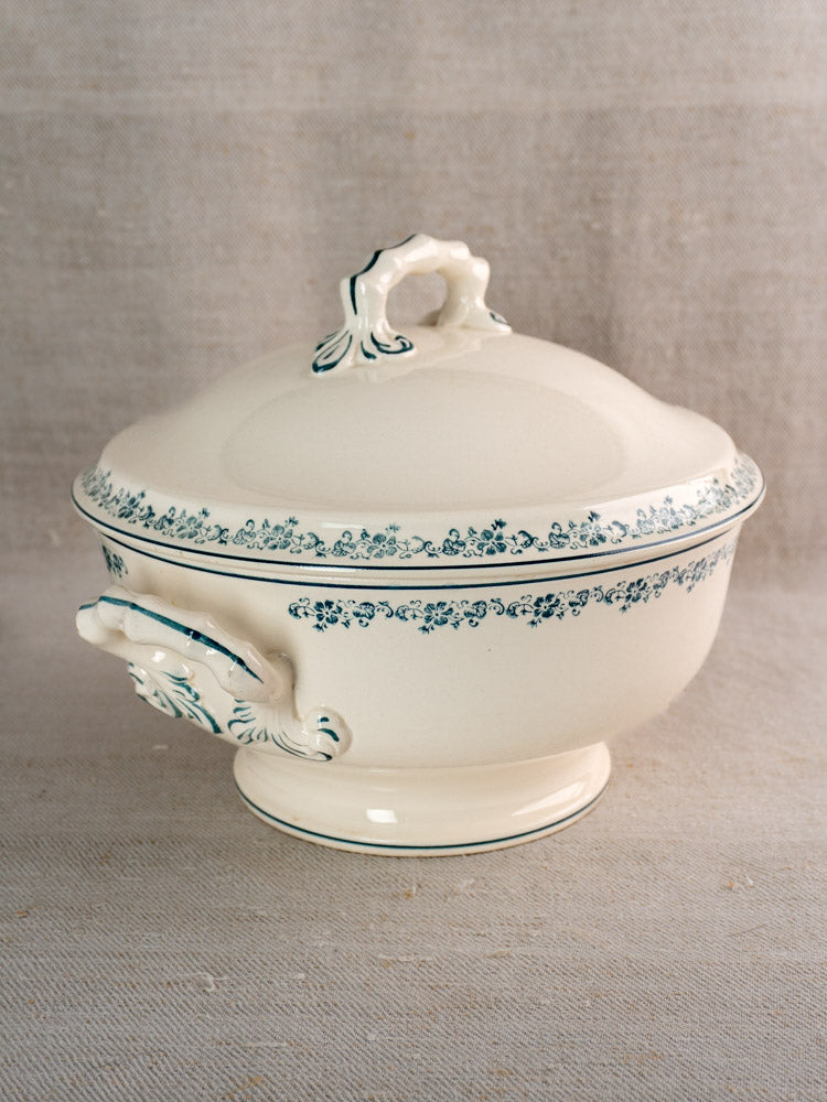 Antique French Longwy ironstone soup tureen in Capucine Blue pattern on neutral fabric background.