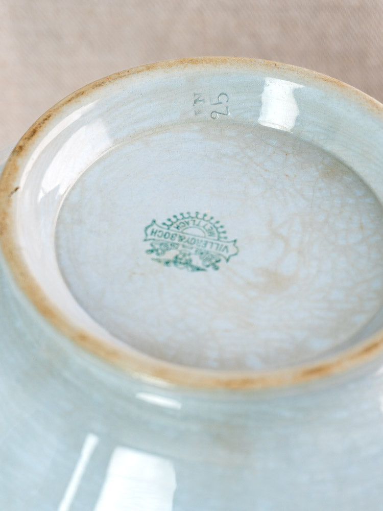 Underside of antique Villeroy & Boch Mettlach tureen with blue crackled glaze, tan rim, green maker’s mark.