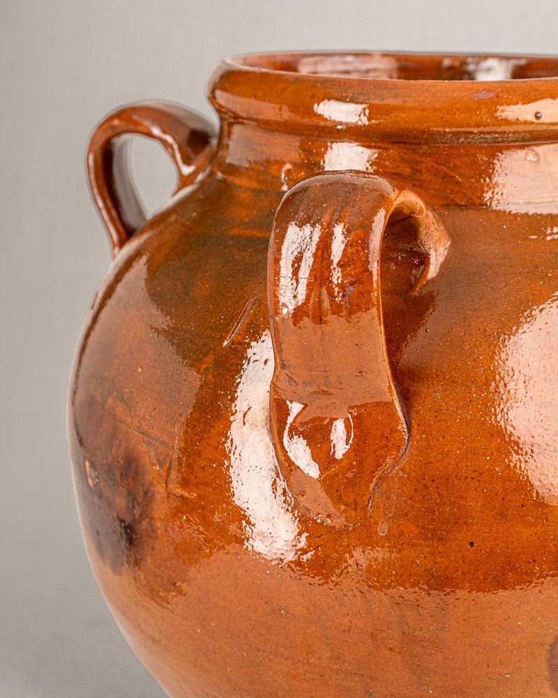 Antique 19th-century French Provencal terracotta oil jar with glossy brown glaze and two curved handles.
