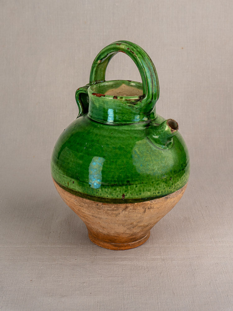 Antique French Provençal terracotta gargoulette with green glazed top, unglazed base, handle, and small spout.