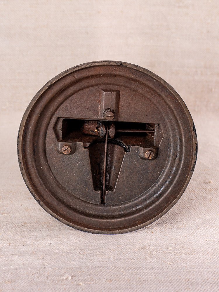Antique Salter Wirthschafts Waage No. 50 cast iron kitchen scale with round form on beige textured surface.