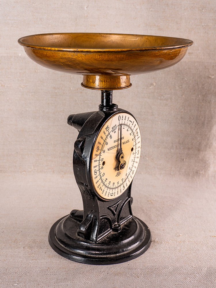 Antique Salter Wirthschafts Waage No. 50 cast iron kitchen scale with black and brass accents, round dial, wide bowl.