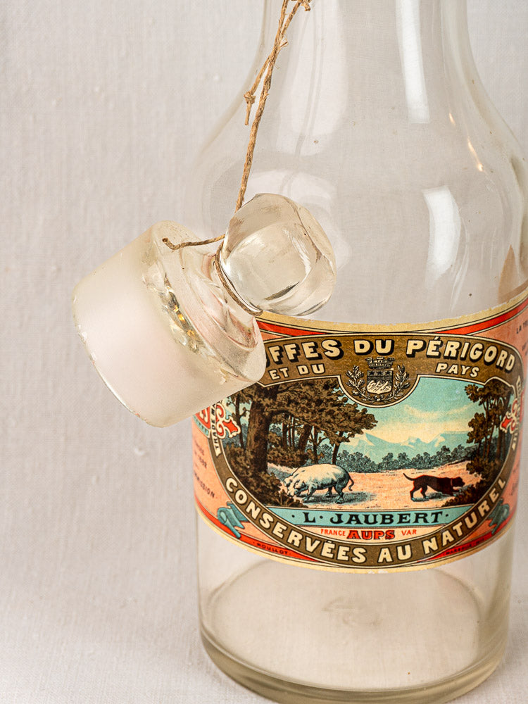 Set of three antique French L. Jaubert truffle jars, vintage glass bottles with landscape labels and glass stoppers.