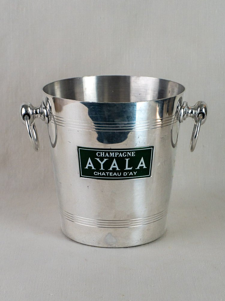 Vintage French aluminum Ayala champagne bucket with side handles and embossed front label detail.