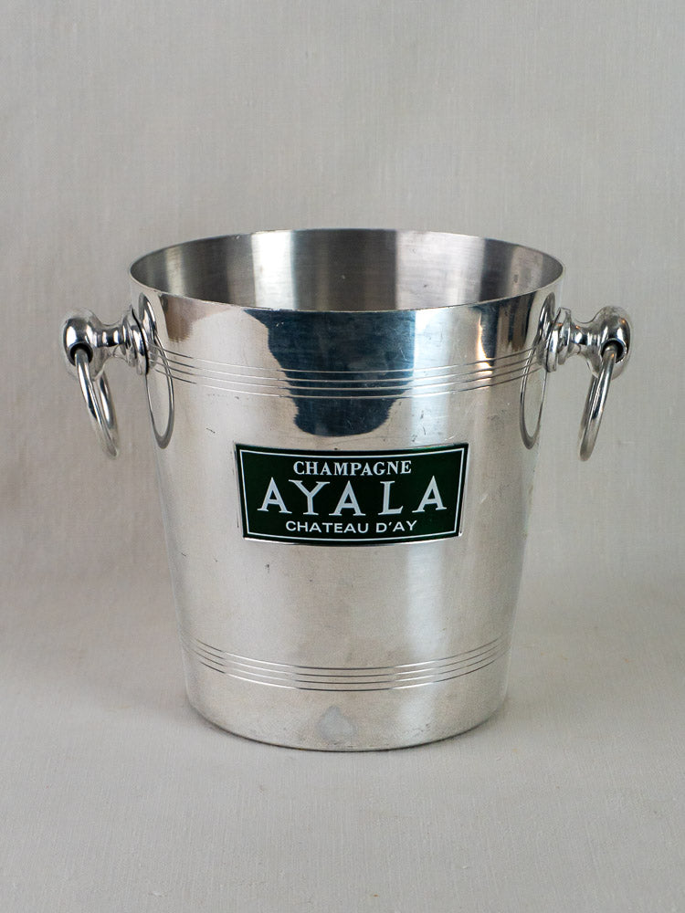 Vintage French aluminum Ayala champagne bucket with side handles and embossed front label detail.