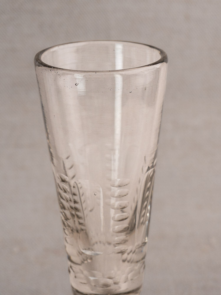 Set of six antique French uranium glass beer flutes with flared rims and etched leaf pattern, circa 1900.