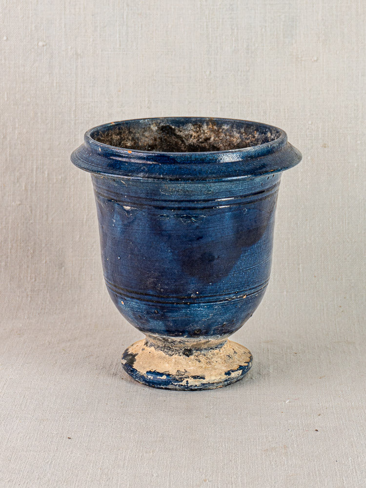 Antique French Medici vase, blue glazed terracotta with wide rim, flared body, beige wear and textured glossy finish.