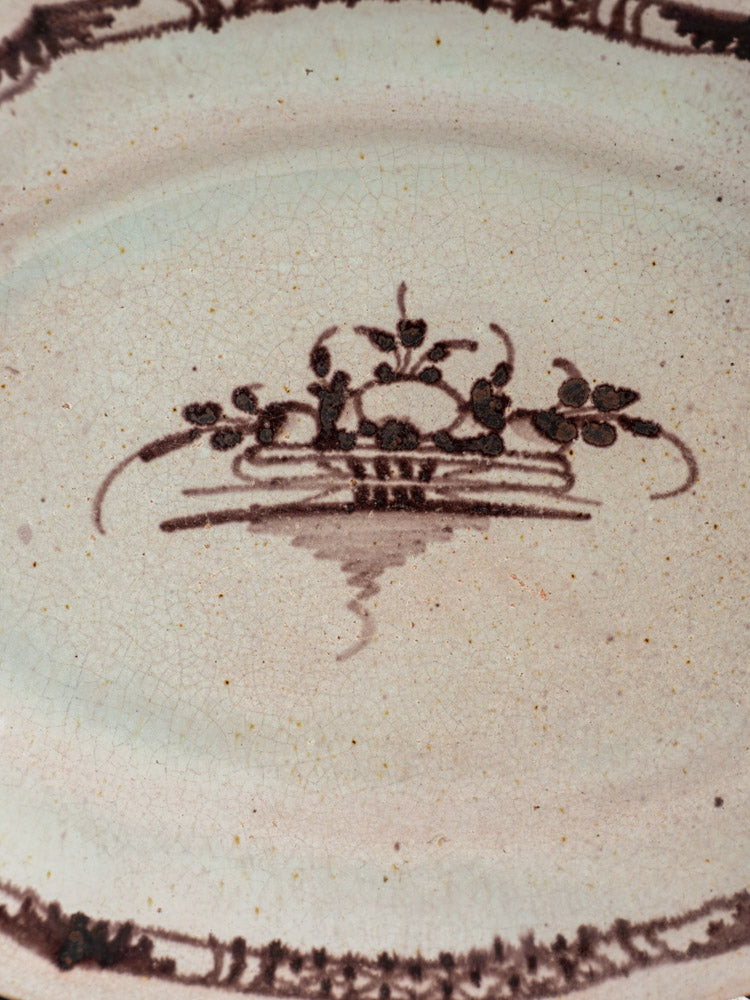 Antique French faience Cul Noir platter with brown floral detail and fine crackled cream glaze, late 18th century.