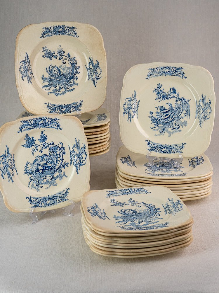 Antique French Clairefontaine faience Louis XV Terre de Fer plates, blue transferware, cream backgrounds.