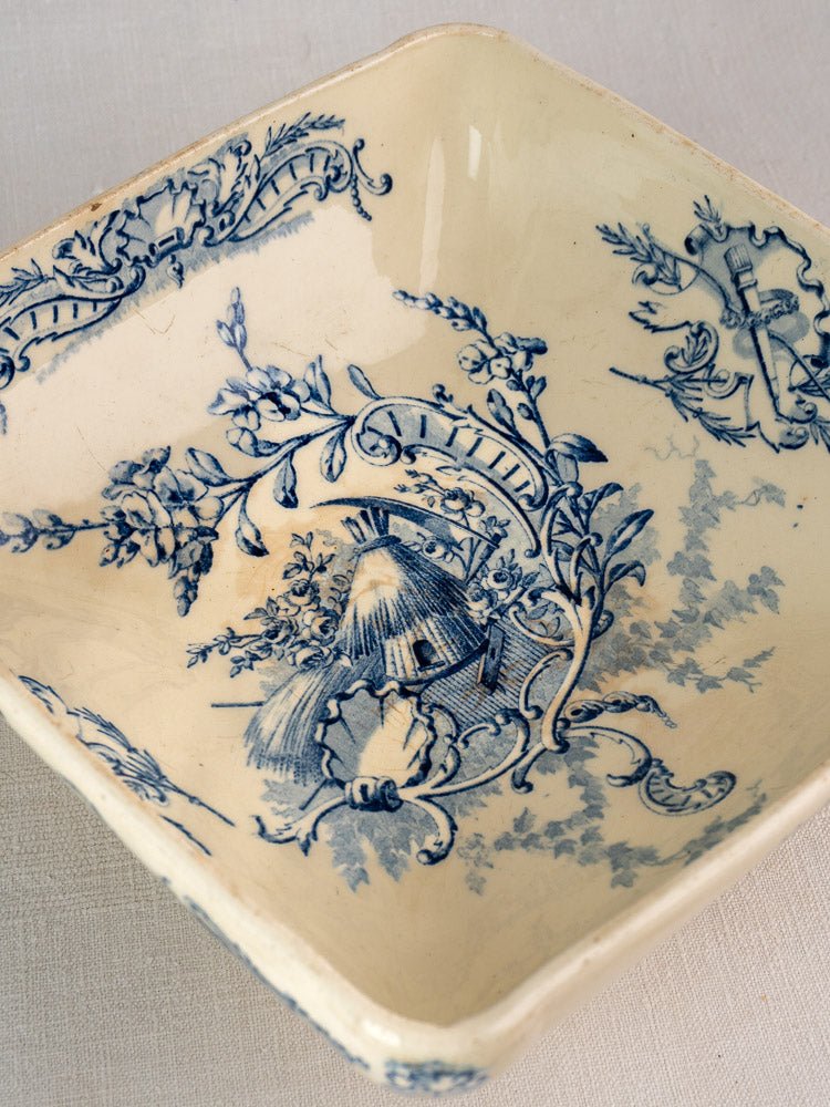 Square antique French Clairefontaine faience bowl with blue floral and windmill motifs on cream.