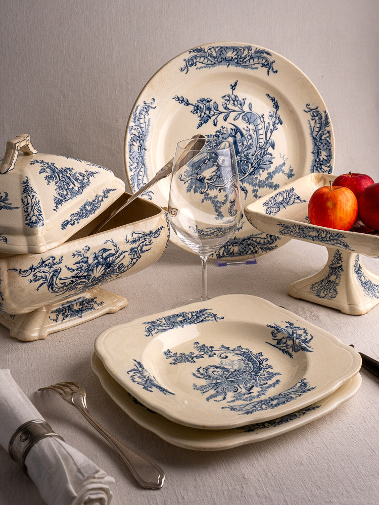 40-piece antique French Clairefontaine faience dinnerware set with blue floral motifs on white ceramic.