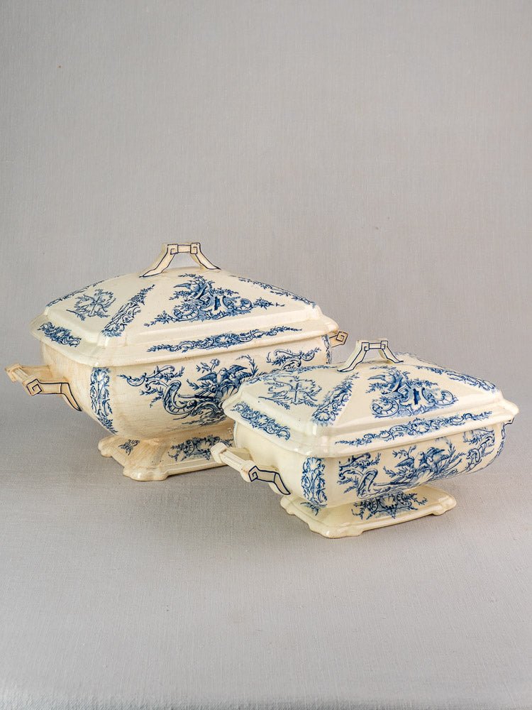 Antique French Clairefontaine faience tureens with blue floral designs and geometric handles.