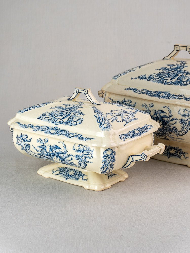 Antique French Clairefontaine faience tureen with blue floral and bird motifs, ornate handles, matching lid.