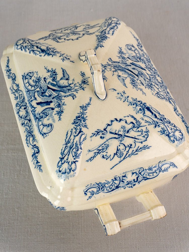 Antique French Clairefontaine faience dish with lid, blue floral and bird motifs on cream ceramic.