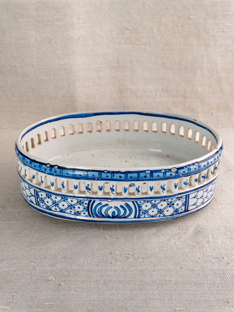 Antique French faience jardinière by Pouplard Béatrix with cobalt blue patterns, on neutral fabric background.