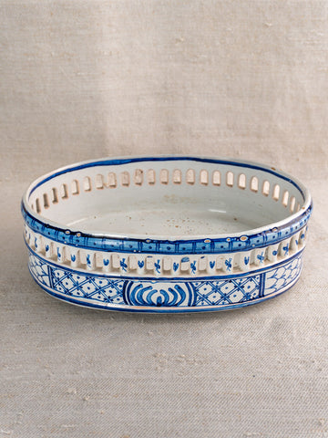 Antique French faience jardinière by Pouplard Béatrix with cobalt blue patterns, on neutral fabric background.
