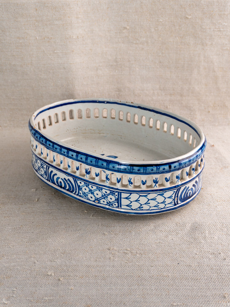 Antique French faience jardinière by Pouplard Béatrix with cobalt blue glaze and cut-out ovals on beige fabric.