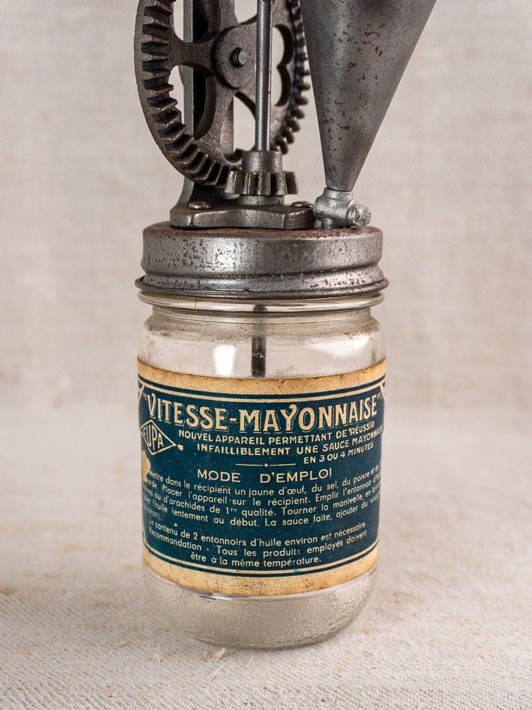 Antique French Vitesse Baratte mayonnaise maker with vintage glass jar and metal hand mixer, 1920s.