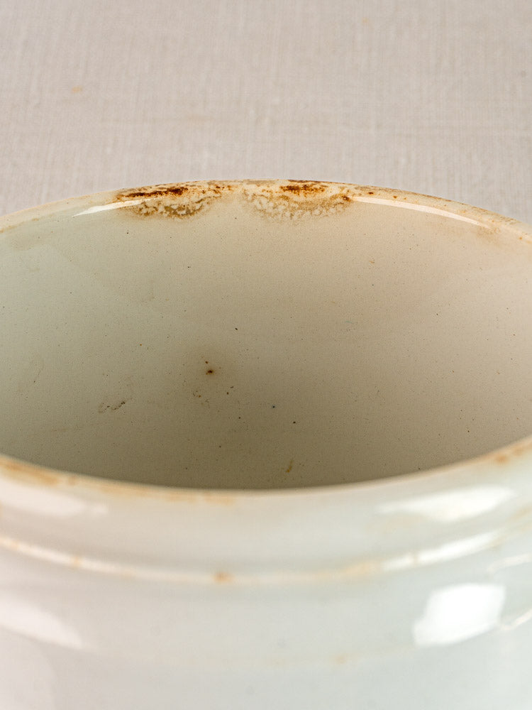 Antique French Fenal Badonviller rillettes pot rim in white ironstone with brown edge stains.