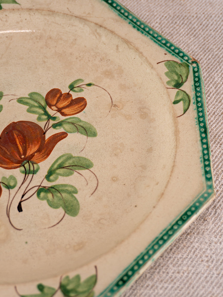 Antique French faience plate from Aumale, octagonal with beaded rim, green border, hand-painted floral motifs.