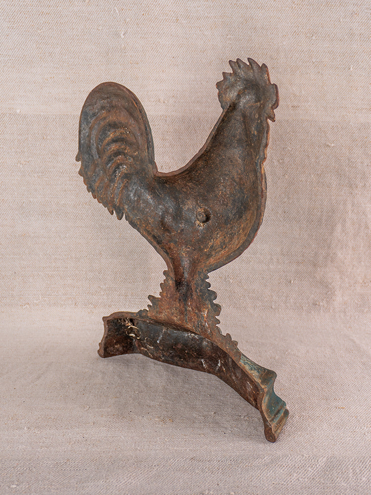 Antique French cast iron rooster doorstop with polychrome finish on curved base, late 19th century.