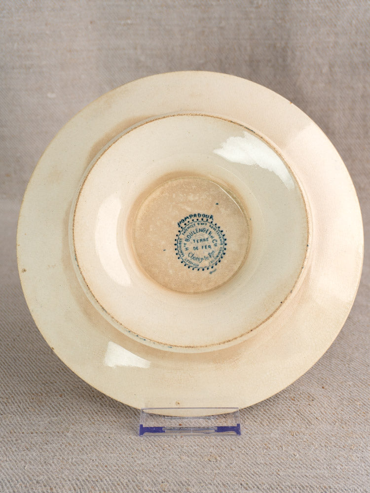 Antique French Boulenger Choisy-le-Roi compote plate, Pompadour pattern, blue maker’s stamp, on clear stand with beige fabric background.