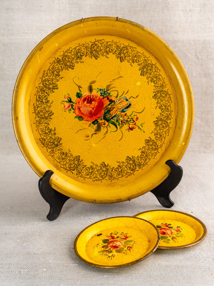 Antique French Tole Tray set with hand-painted floral motifs, ornate borders, yellow lacquered finish.