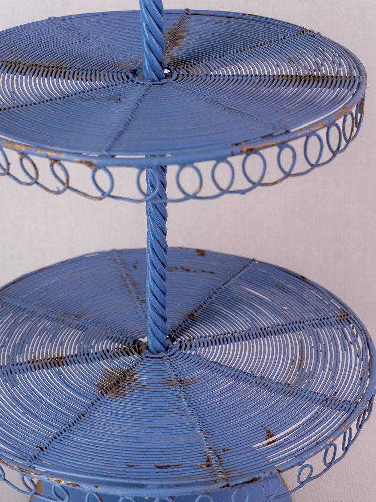 Antique French blue three-tier wire pâtisserie stand with spiral detailing and vintage patina.