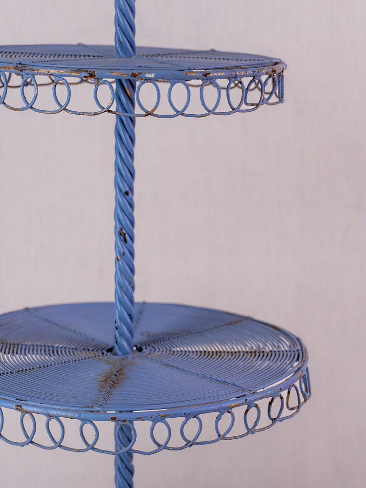 Antique French blue three-tier wirework pâtisserie stand with looped edging and aged paint.